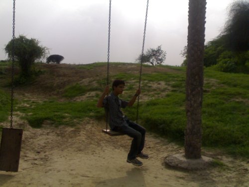 Raju playing with the swing..